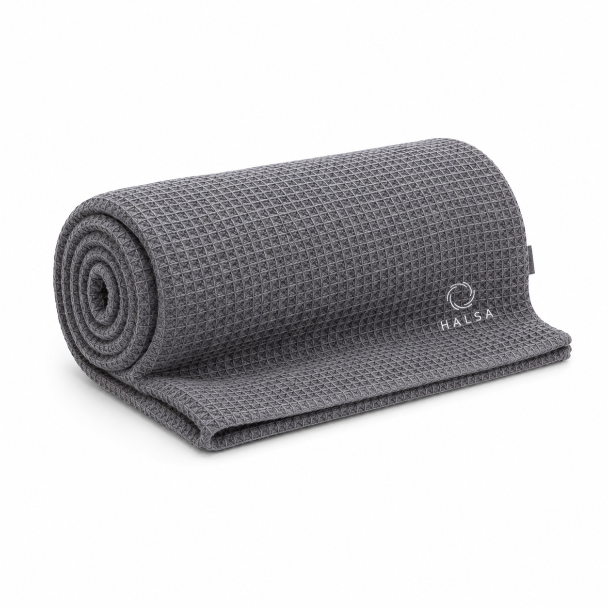 Halsa Waffle Sauna Towel in grey 100% cotton rolled up with the white embroidered HALSA logo visible — studio product shot