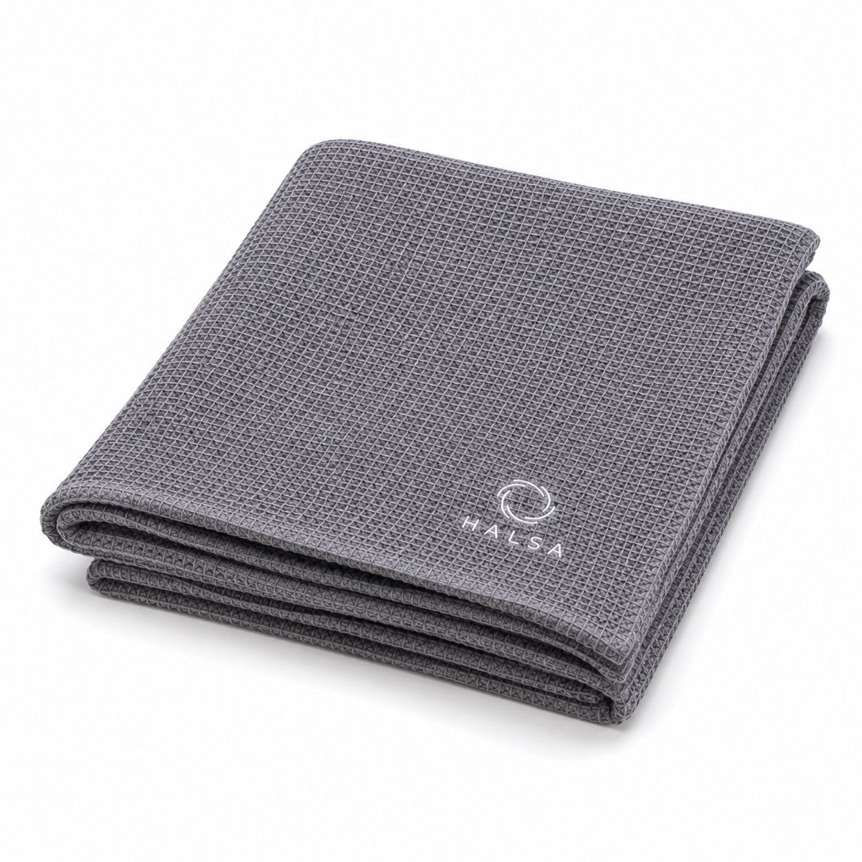 Halsa Waffle Sauna Towel folded flat showing the grey waffle-weave texture and white embroidered HALSA logo in the corner